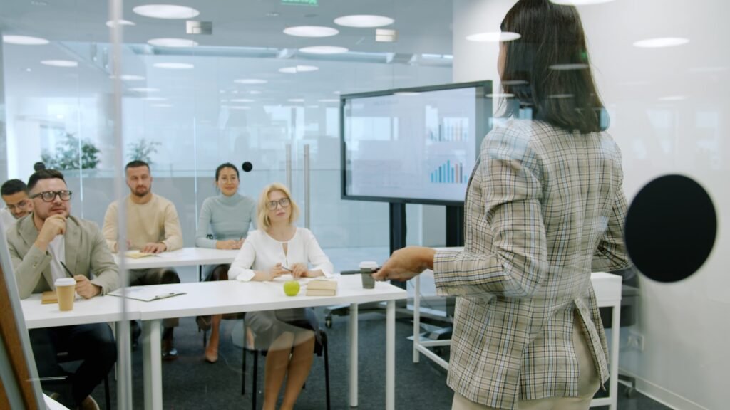 Best AI Roleplay Tools for Corporate Training (2026) Trainer leading a team session, representing AI roleplay tools that give employees unlimited conversation practice