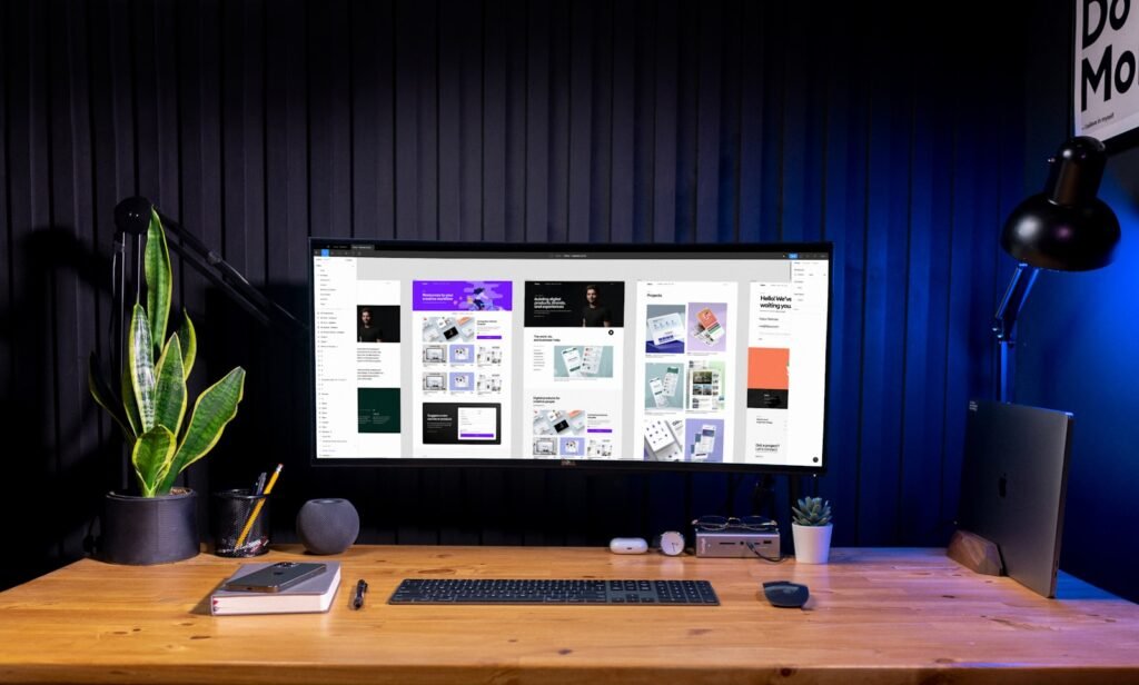 Best AI Tools for Facebook & Instagram Ad Creatives (2026) Creative workspace with design software open, representing AI tools used to build Facebook and Instagram ad creatives for ecommerce