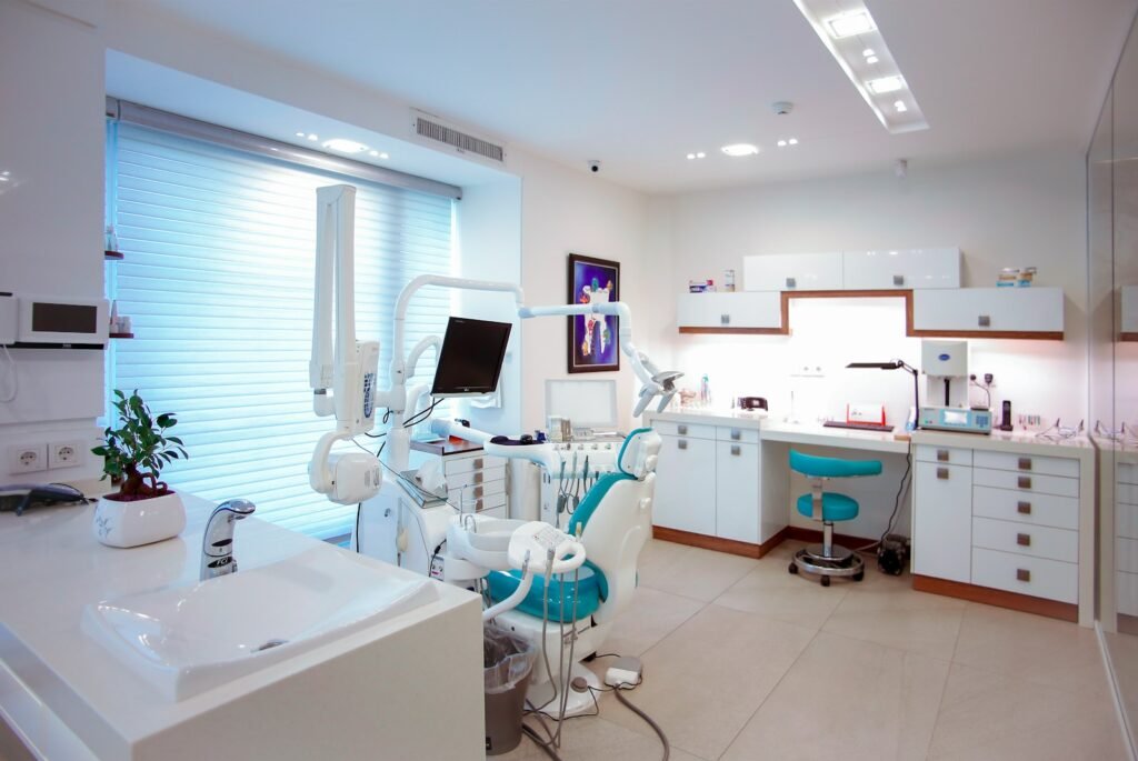 Best AI Tools for Dental Practices (2026): Tested and Compared Modern dental clinic with chair and imaging equipment, representing AI tools for dental diagnostics, claims and patient engagement