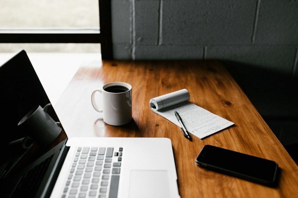 Best AI Tools for Independent Insurance Agents (2026) Agency desk with documents and laptop, representing AI tools for insurance submission intake, quoting and compliance