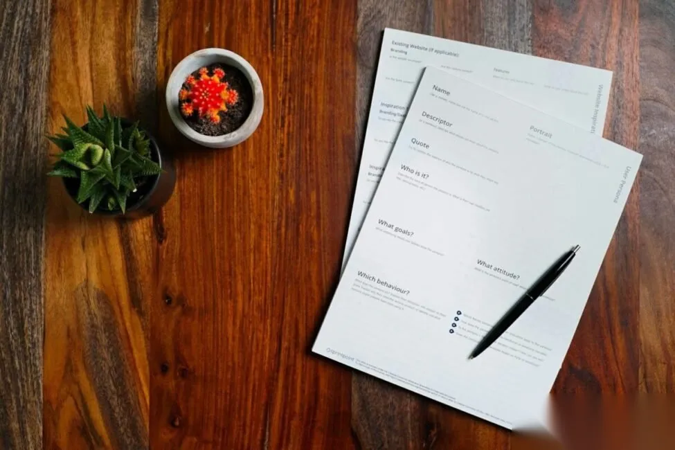 Insurance paperwork and policy documents on an independent agent’s desk
