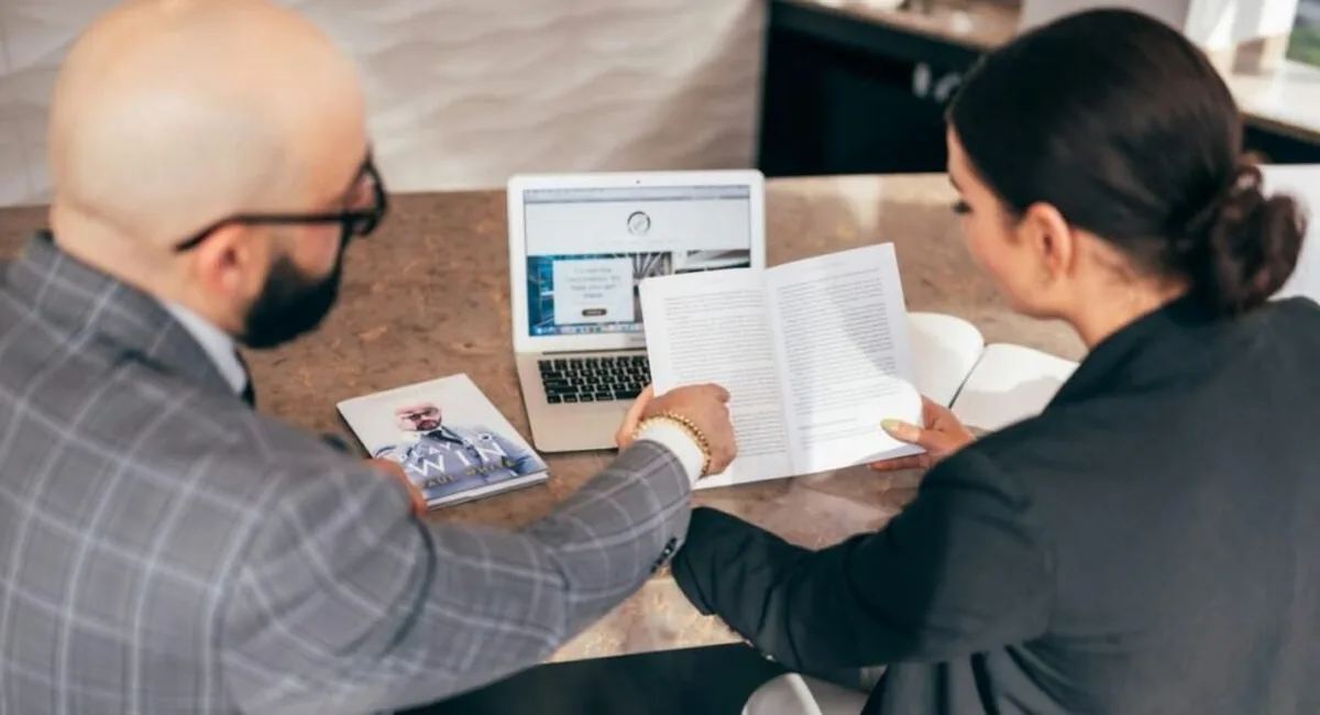 Adviser reviewing a financial report, the human check that must sit between the best AI tools for financial advisors and client advice