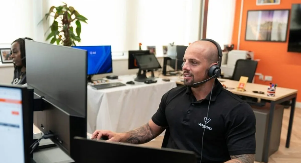 Support agent on a headset using agent assist, one of the best AI tools for support cost reduction, surfacing knowledge base answers live