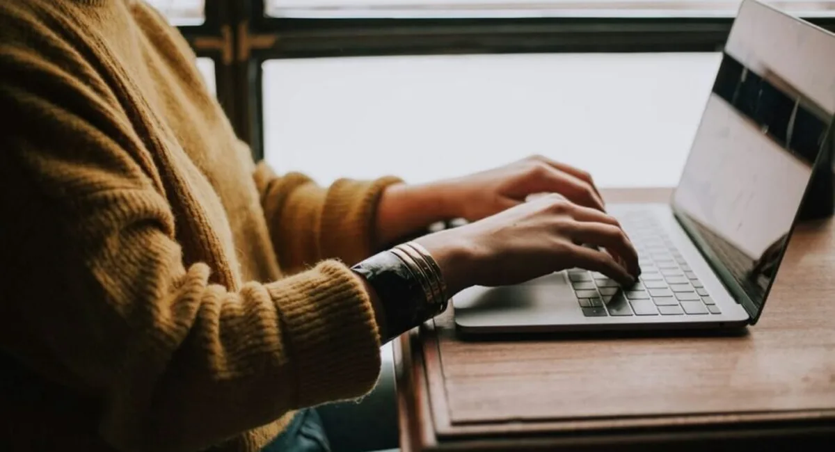 Person tailoring a job application with the best AI tools for job seekers rather than mass-applying to every listing