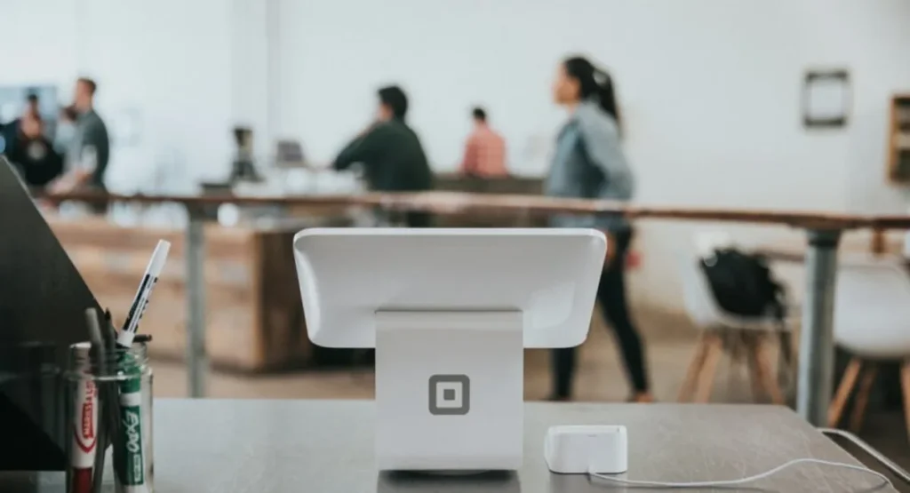 Best AI Tools for Small Businesses 2026: Real Prices Card payment terminal on a shop counter, the everyday small business setting these AI tools serve