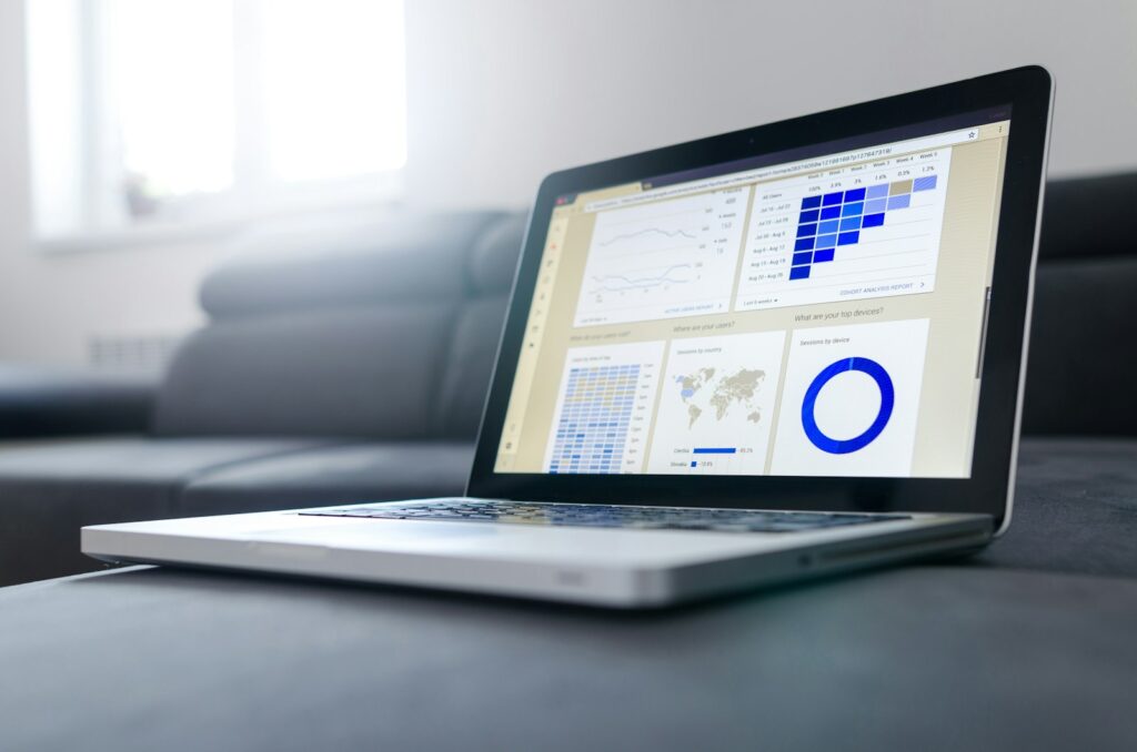 Laptop with performance charts representing the best AI search optimization tools for social media 2025