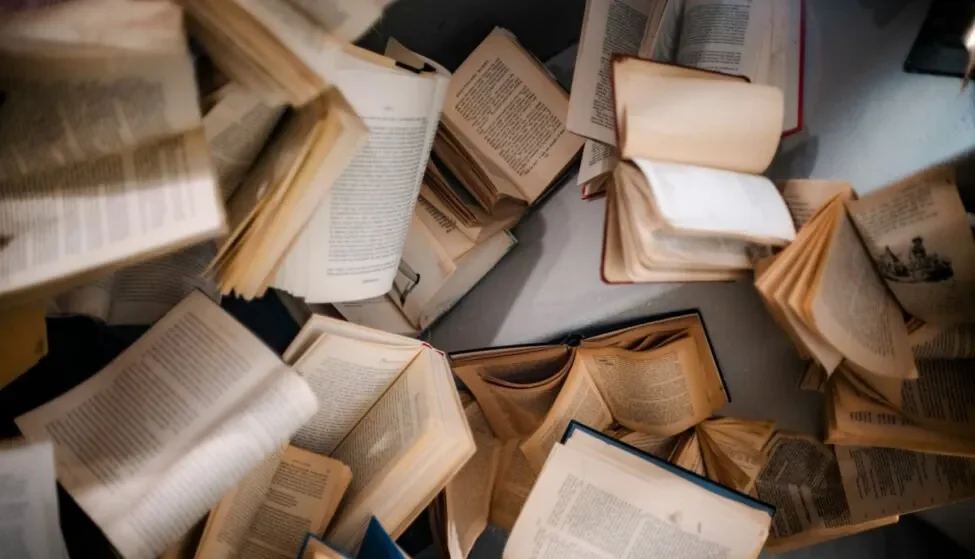 Pile of open books, the research-heavy content financial services firms supervise before publishing
