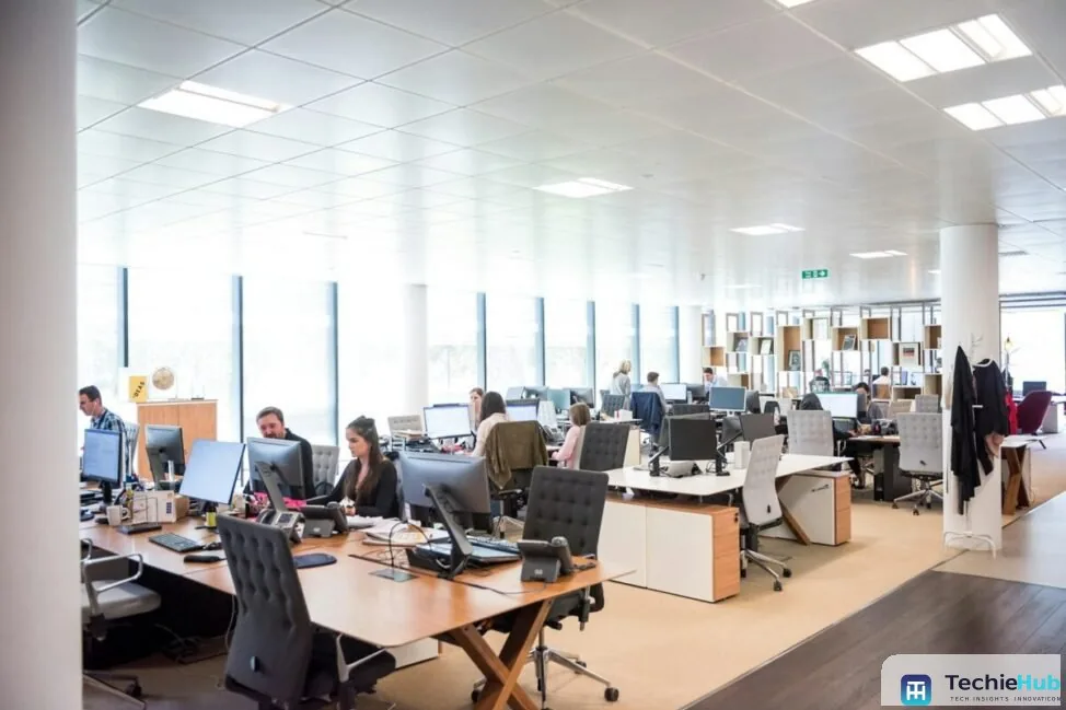 Open-plan support team where the best AI tools for support cost reduction are measured on deflection and resolution rates