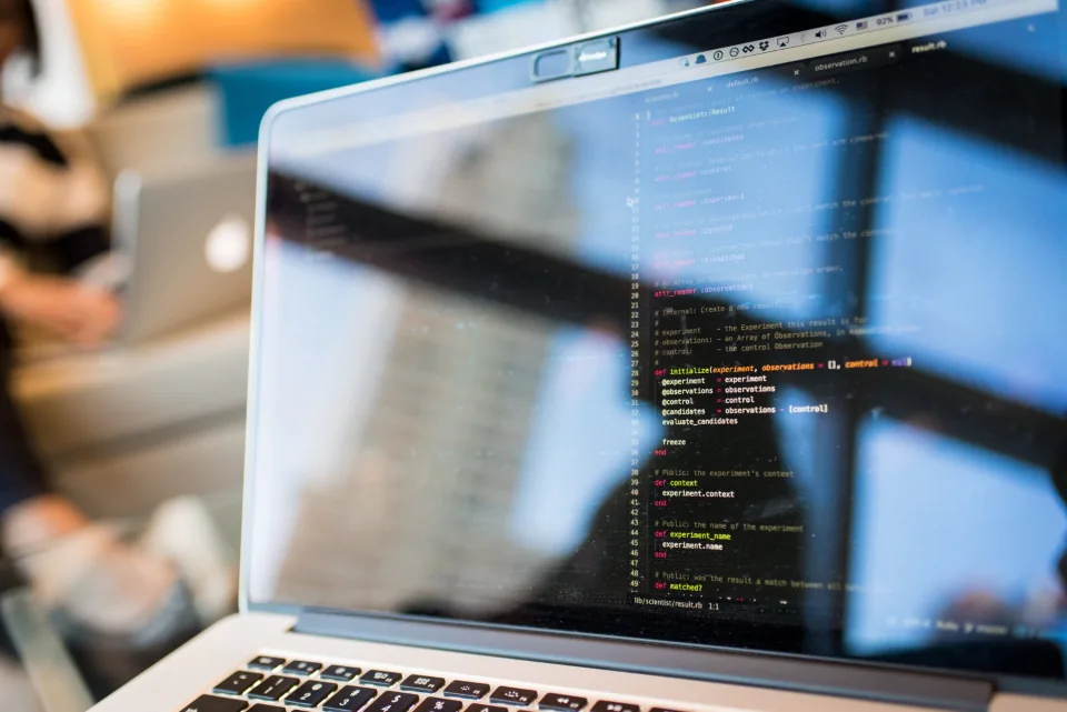 Laptop screen with a code editor open, where developers script local models