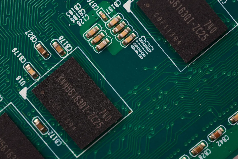 Memory chips on green circuit board Memory chips on a green circuit board, illustrating bandwidth and VRAM for running models