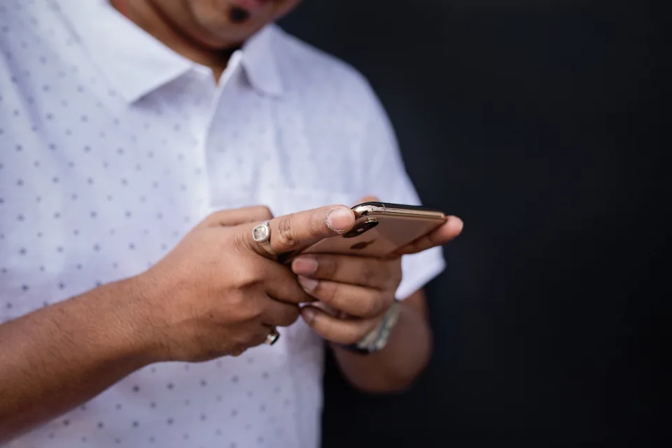 Person using a smartphone, chatting with an AI model that runs offline on the device