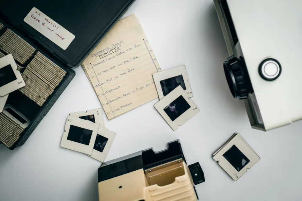 Slide viewer and photo slides on a desk, still images that image-to-video models can animate